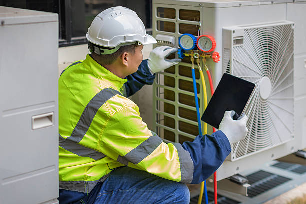 Professional Emergency Ac Repair technician working in Hastings, NY